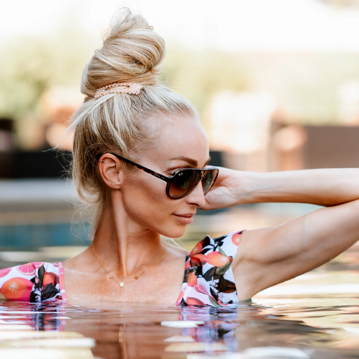 Young blonde woman enjoying the pool